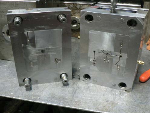 Two-plate injection mould tool, cavity and core halves